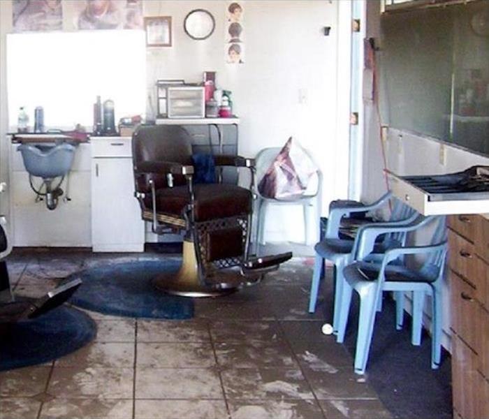 sewage debris on the floor of barbershop, tiled