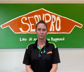 Woman in front of SERVPRO sign