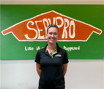 Woman in front of Servpro sign