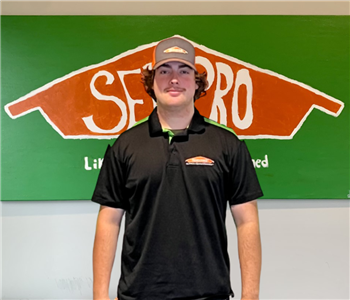 Man in front of SERVPRO Sign