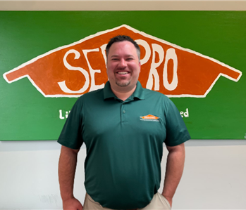 Man in front of Servpro sign